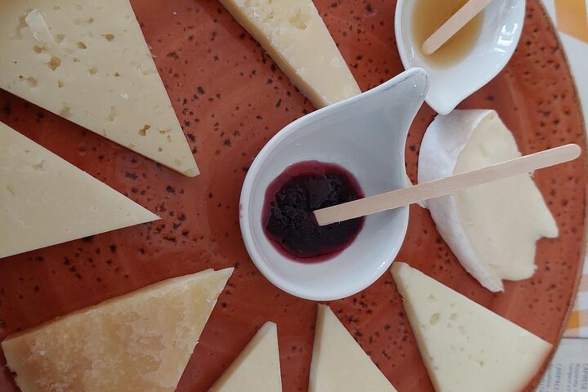 a plate of cheese and a bowl of sauce