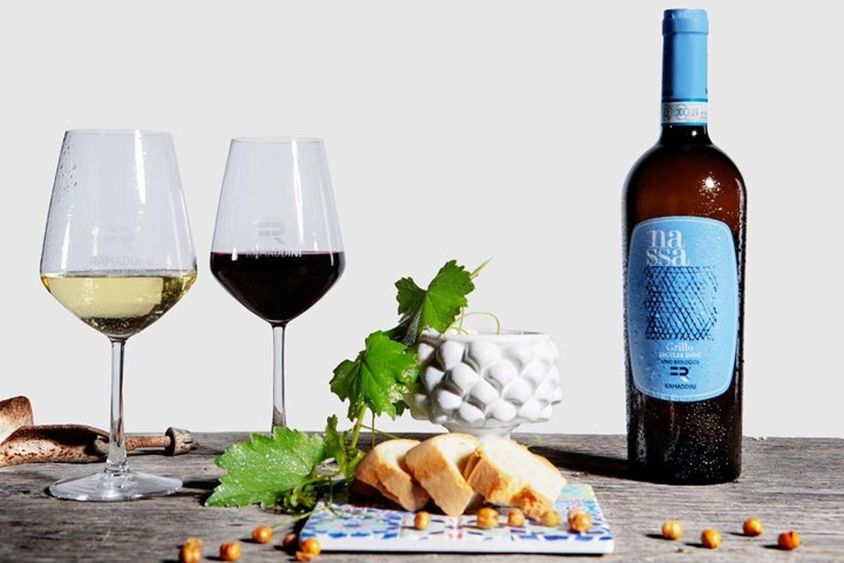 a table with two glasses of wine and bread