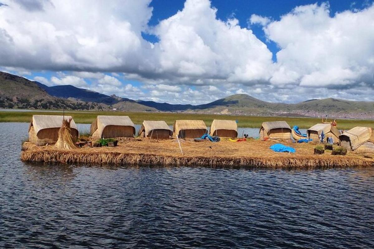 a group of tents on an island in the water