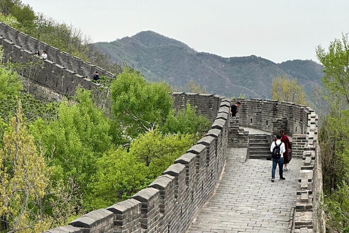 two people walking on the great wall