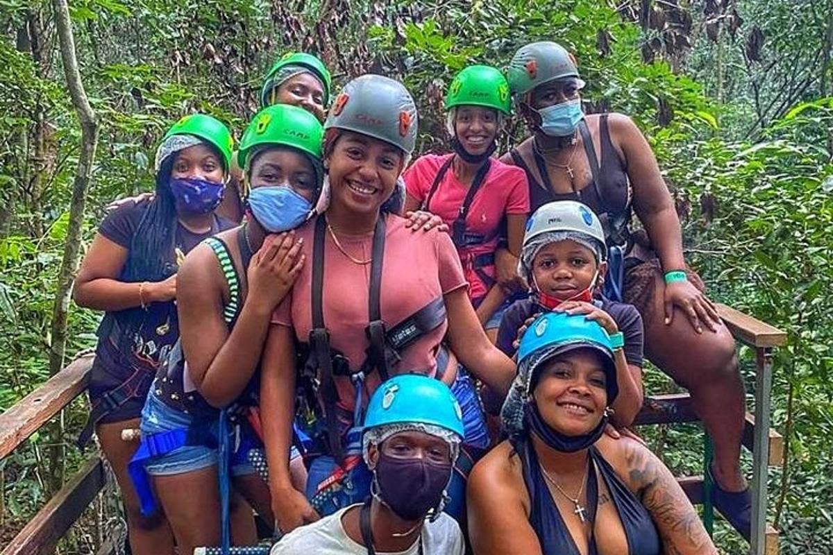 a group of people wearing helmets and face masks on a raft