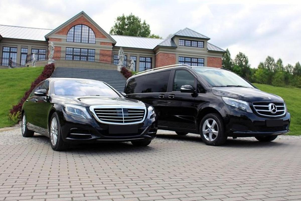 two vehicles parked in front of a house