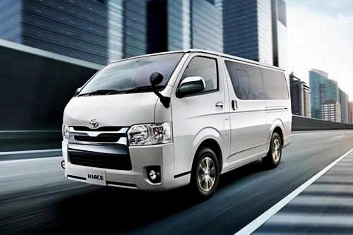 a white van driving down a city street