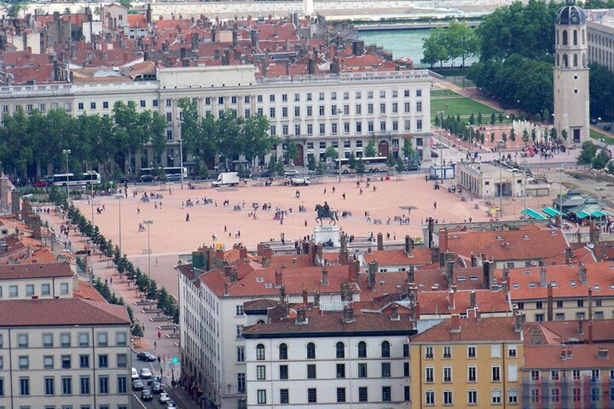 an aerial view of a city with buildings and people