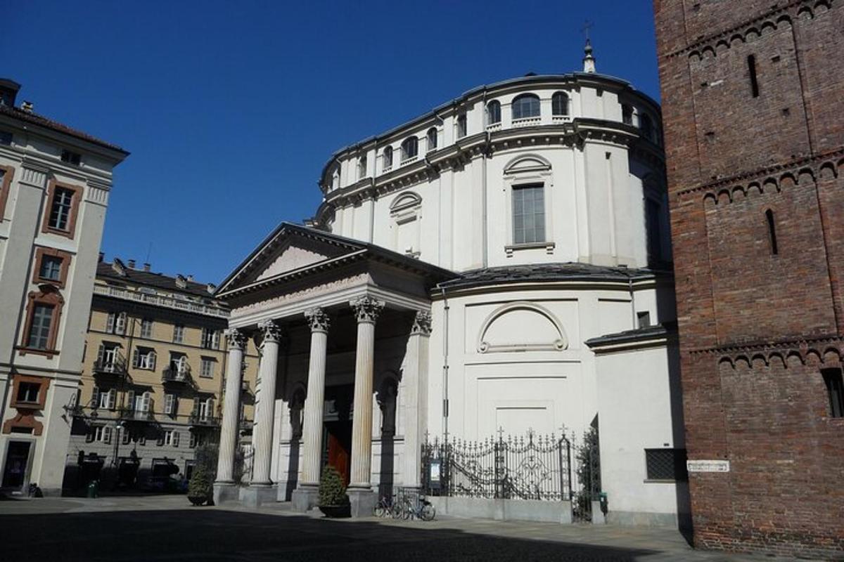 a large white building with columns and a gate