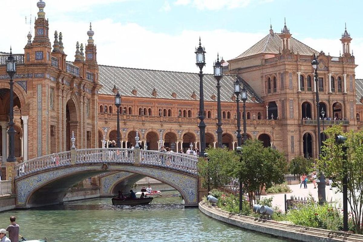 a bridge over a river in front of a building