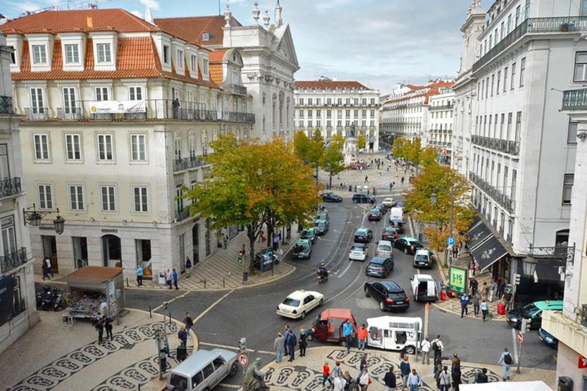 a busy city street with cars and people and buildings