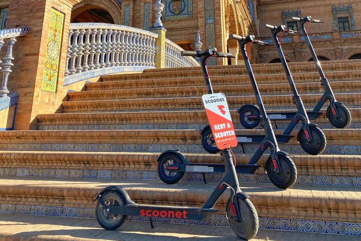 two scooters are parked on the steps of a building