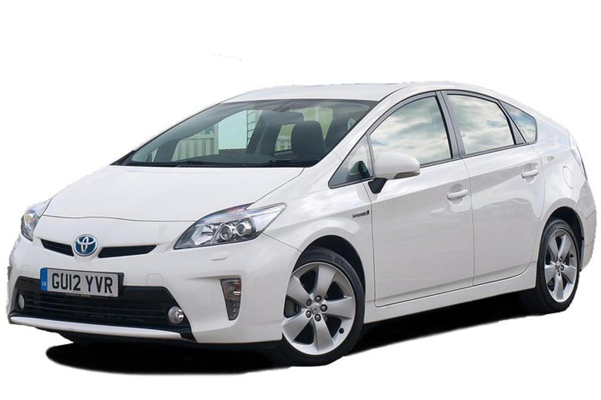 a white toyota aygo hybrid car parked