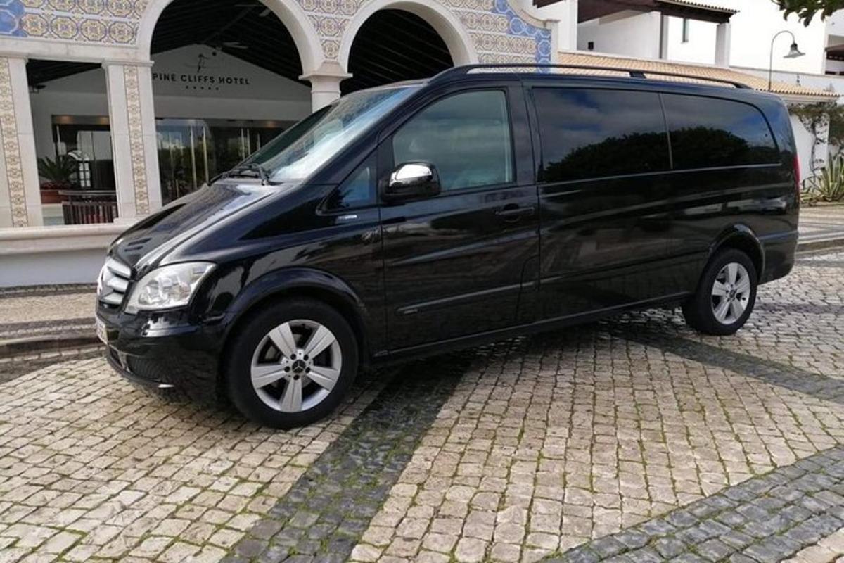 a black van parked in front of a building