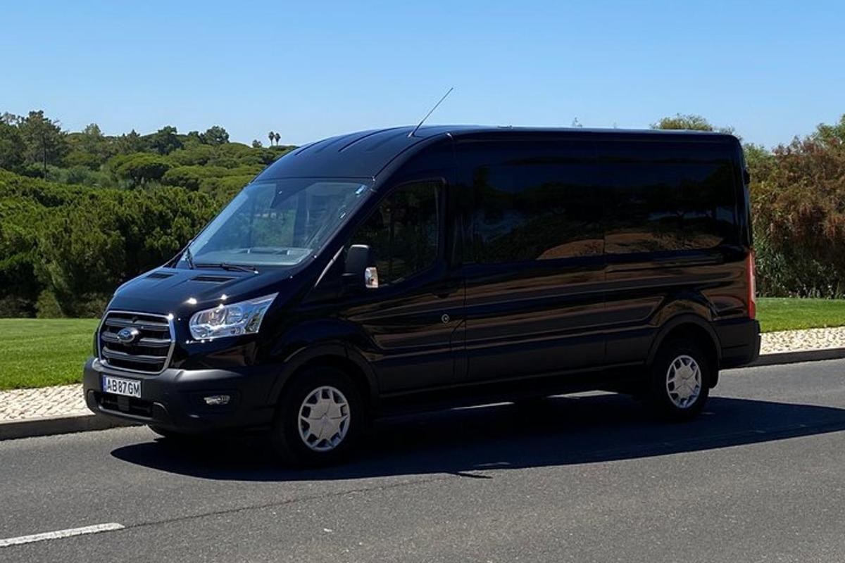 a black van is parked on a road