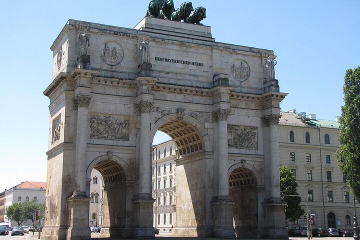 a building with an arch in front of a building