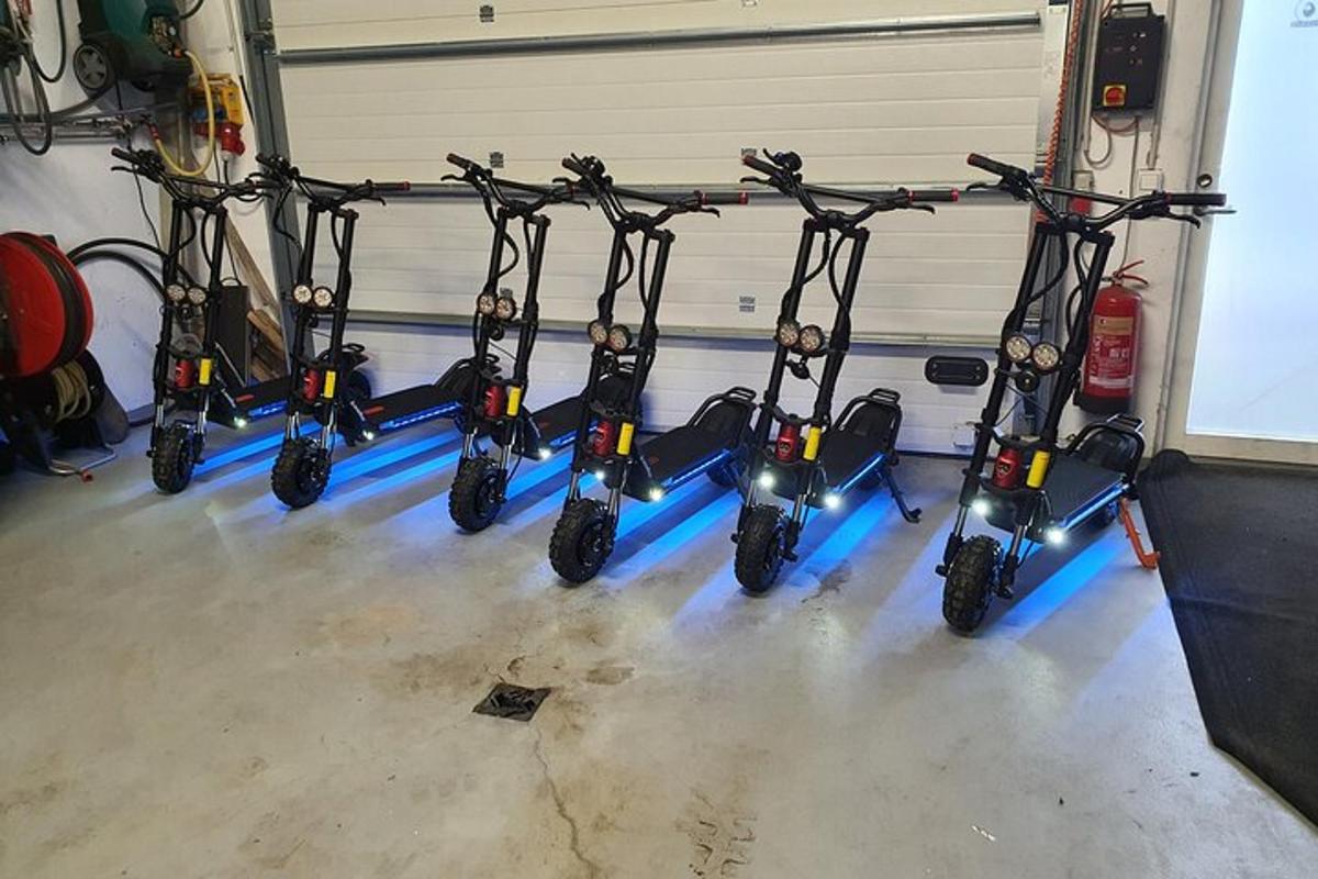 a row of scooters parked in a garage