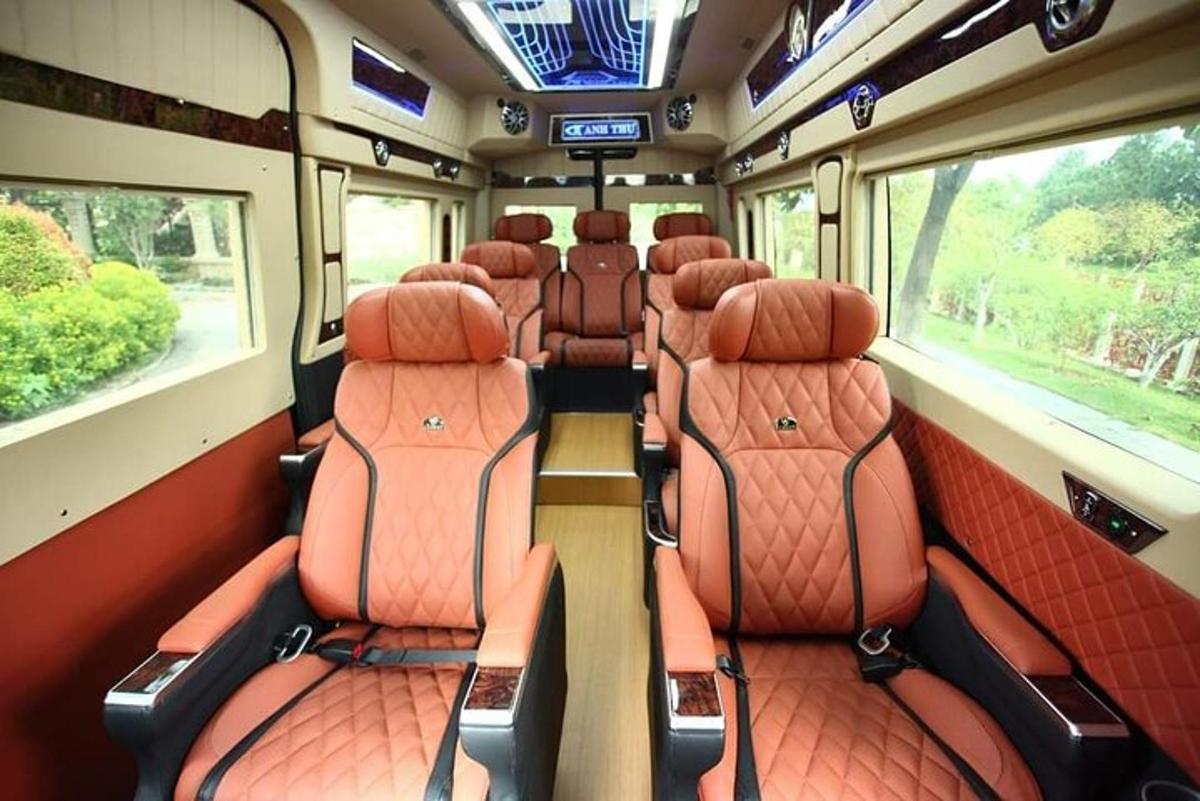 an empty train car with orange seats on a train