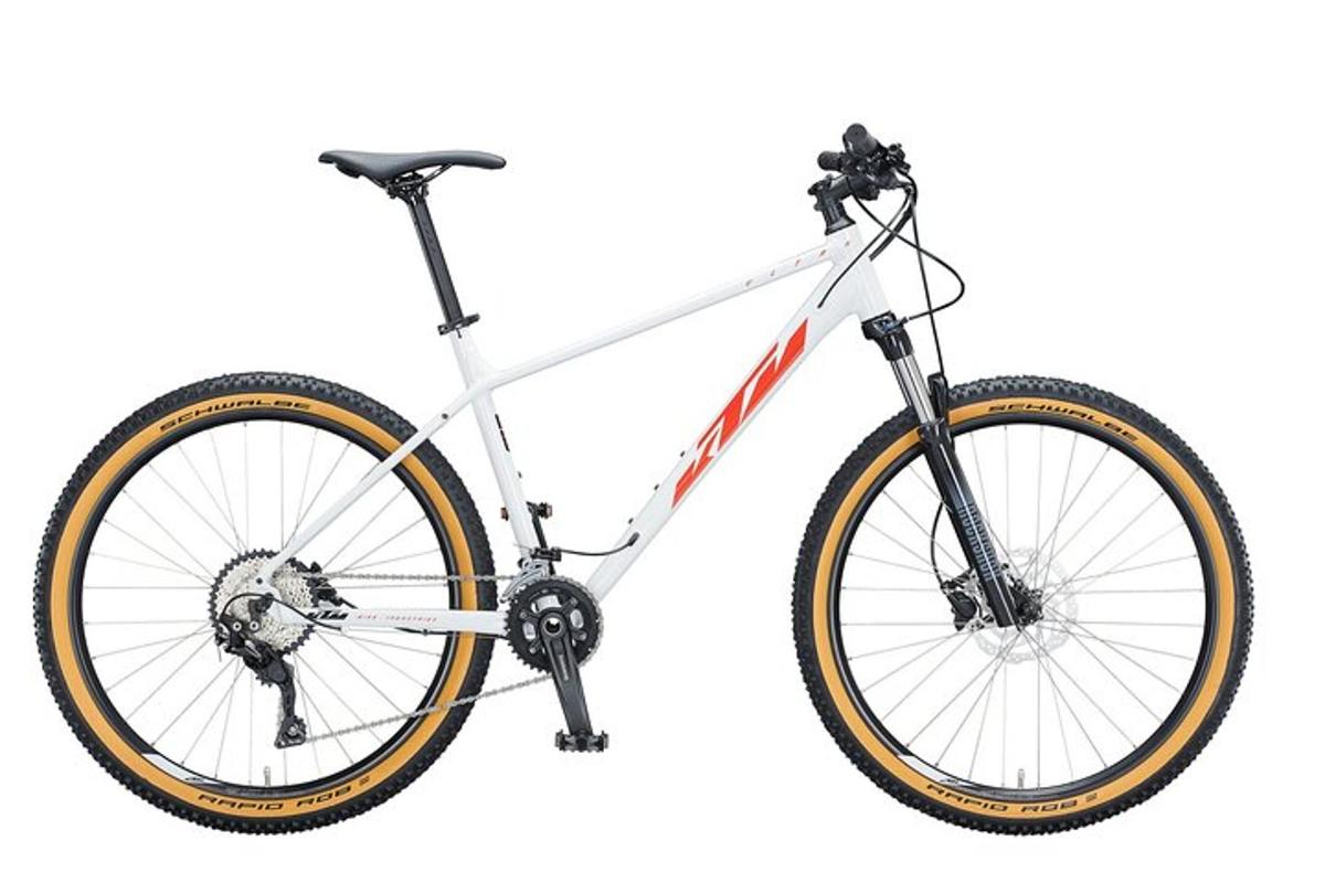 a white and orange bike on a white background