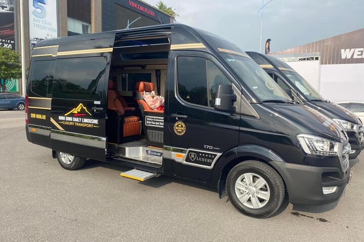 a black van is parked in a parking lot