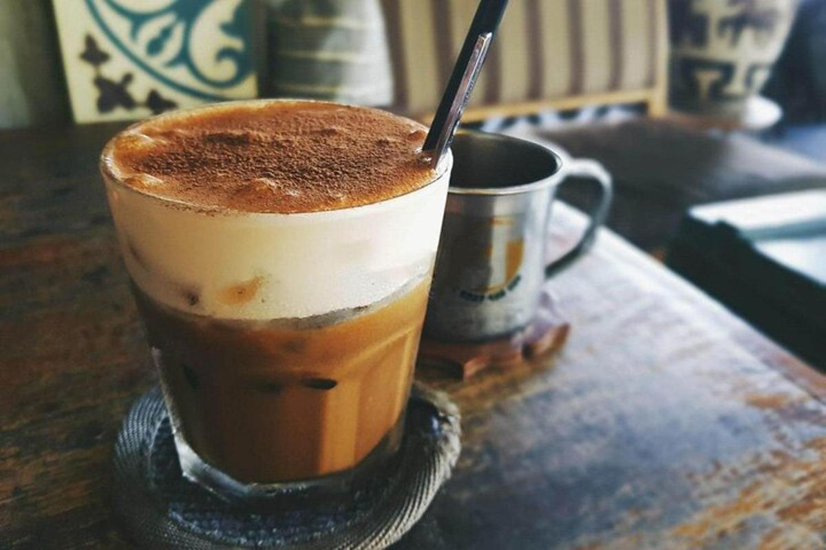 a cup of coffee sitting on top of a table