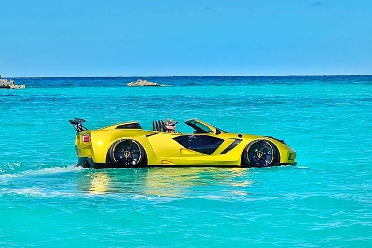 a yellow car in the water in the ocean