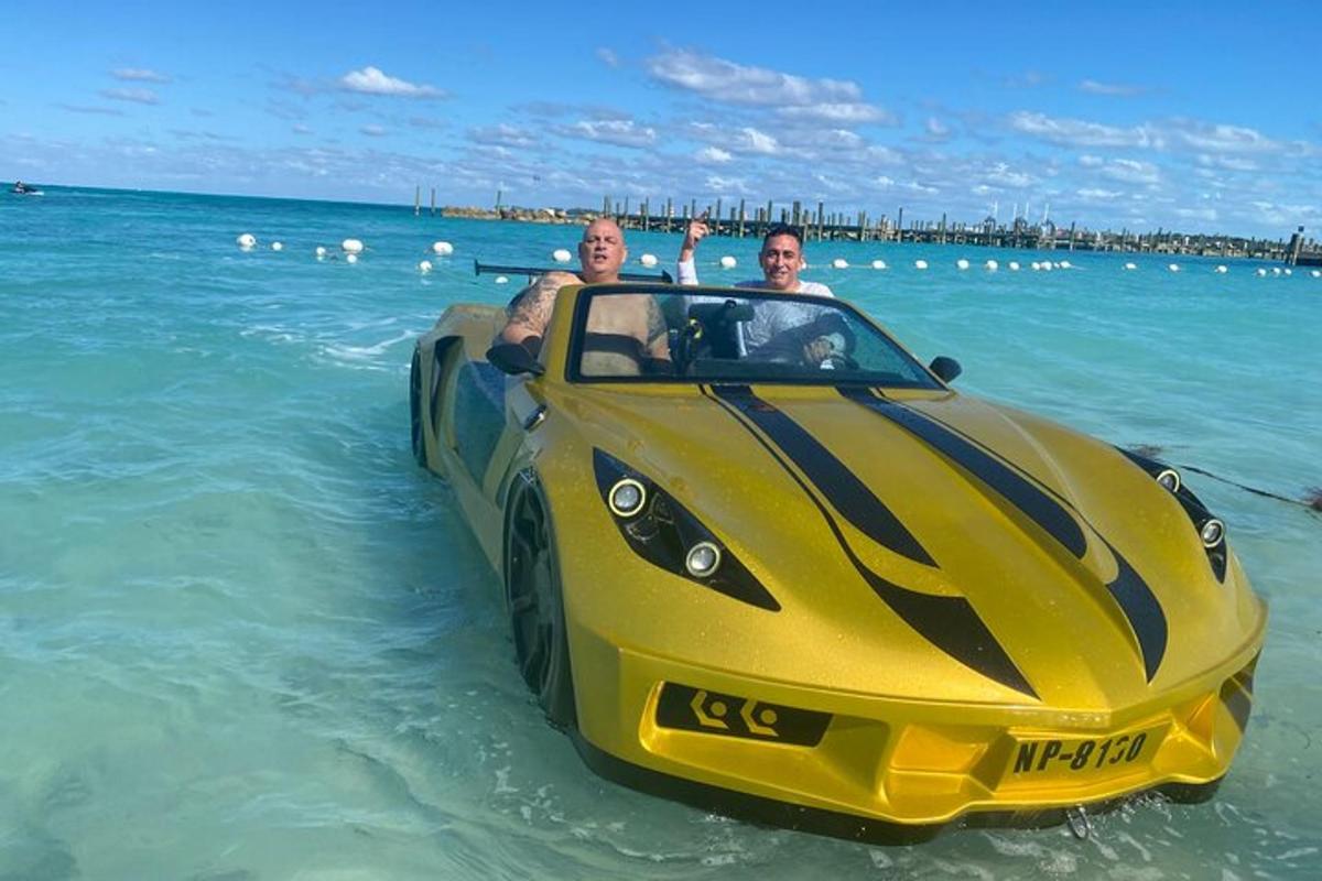 two men in a yellow car in the water