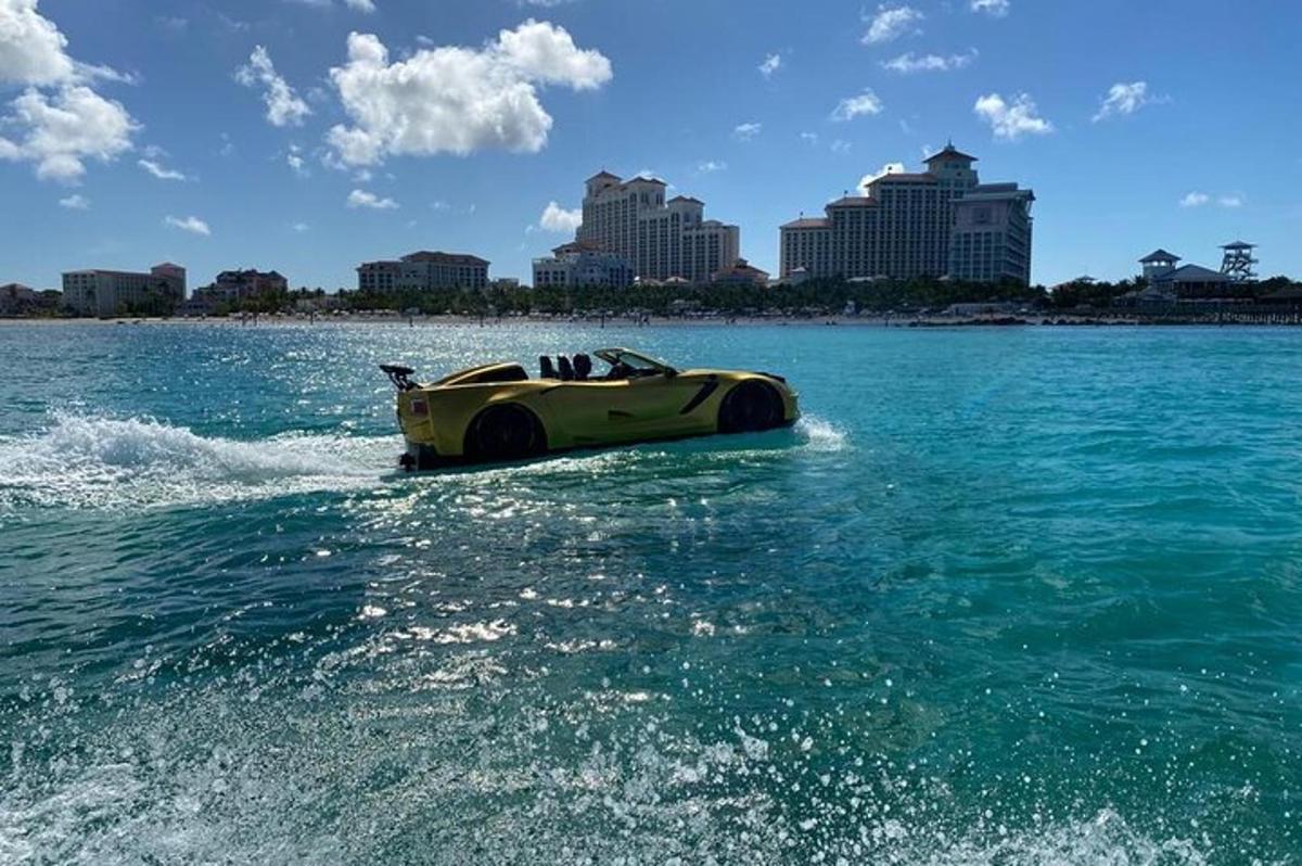 a speed boat in the water with a city in the background