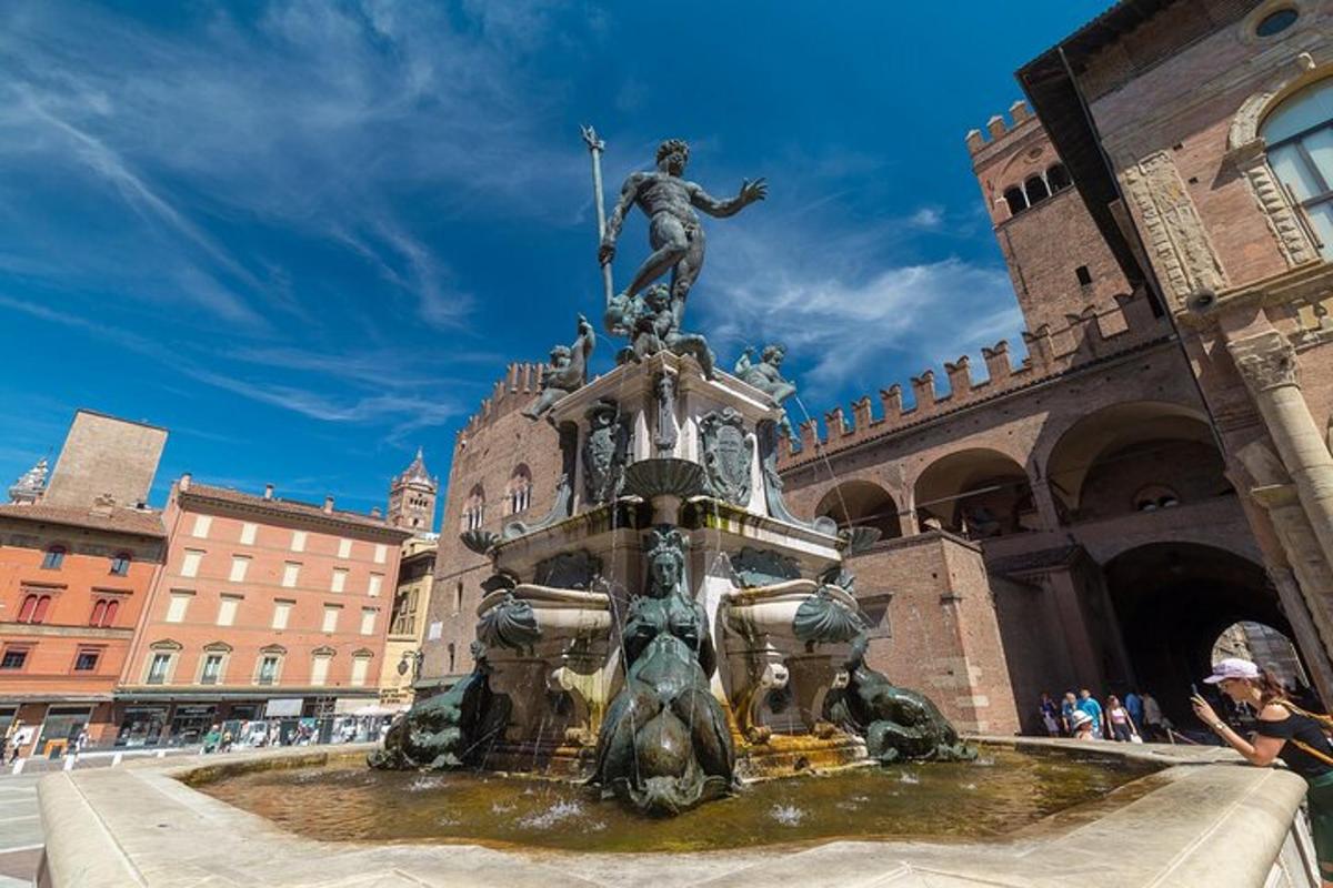 a fountain with a statue in front of a building