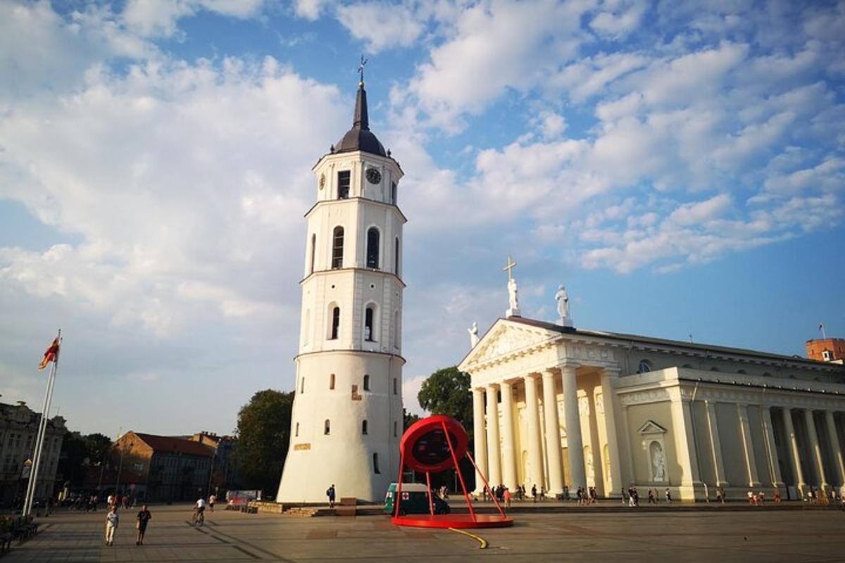 a large white building with a tower in front of it