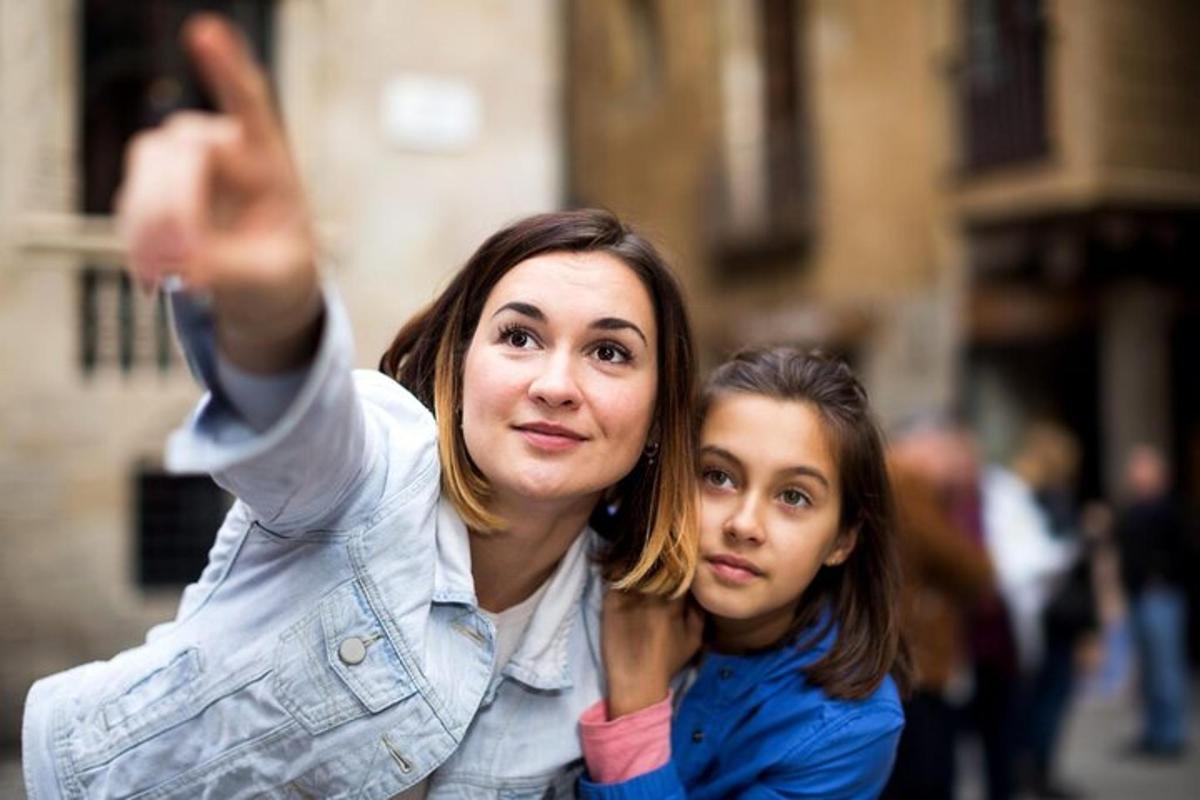 two women standing next to each other taking a picture