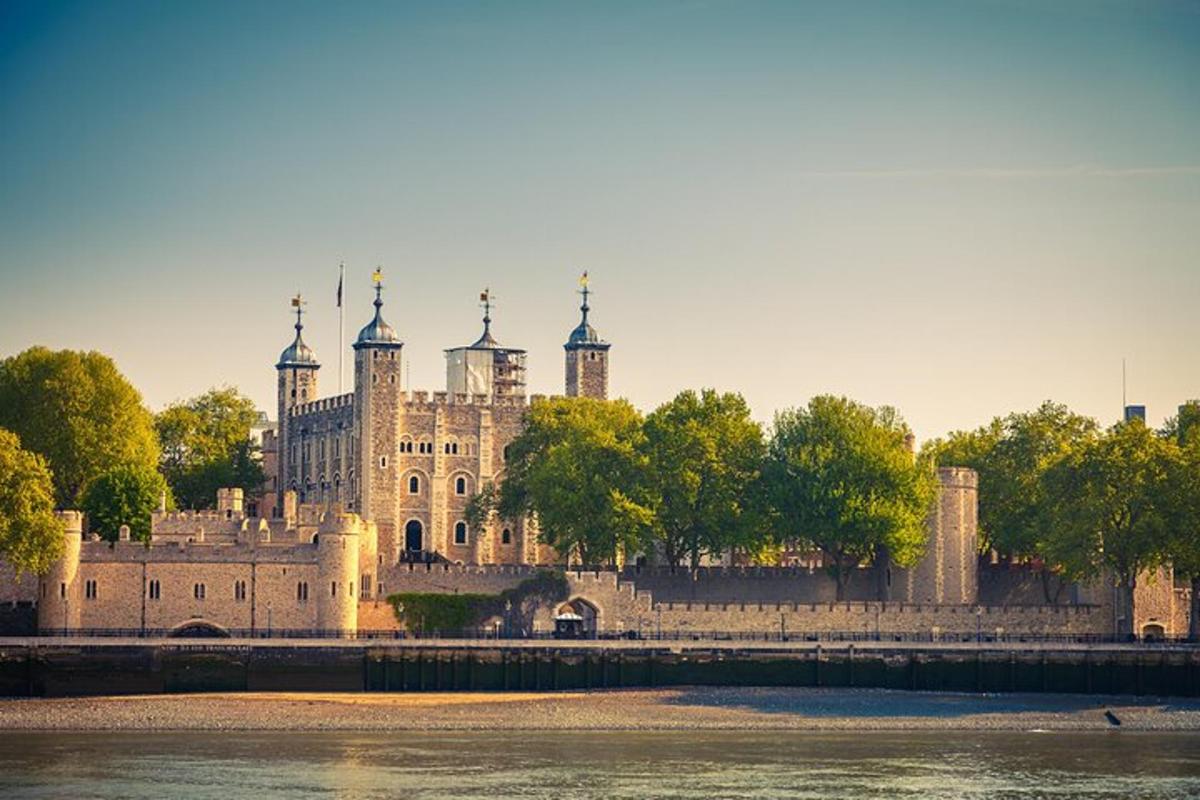 a large castle sitting on the side of a river