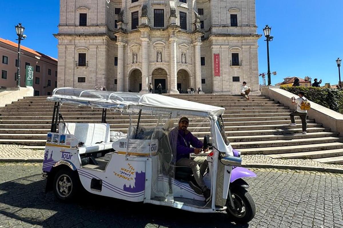 a man riding a golf cart in front of a building