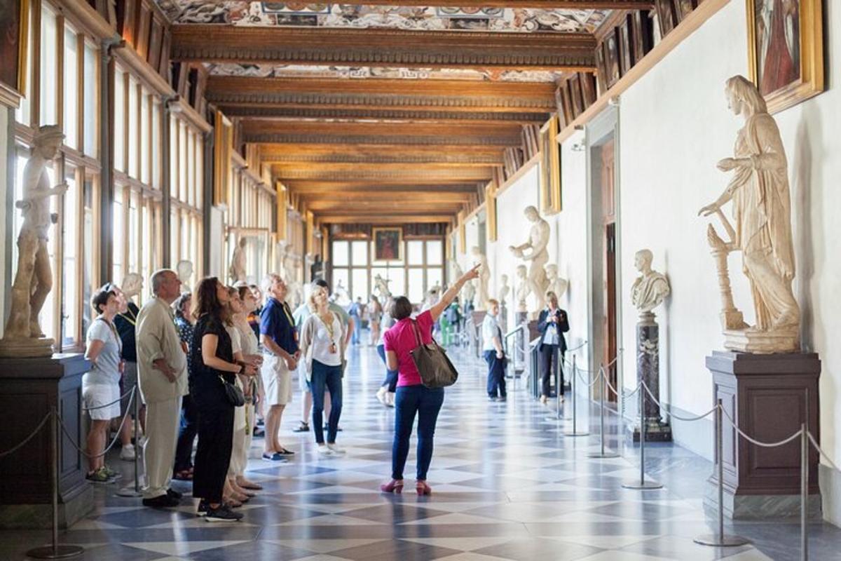 a group of people looking at a painting in a museum
