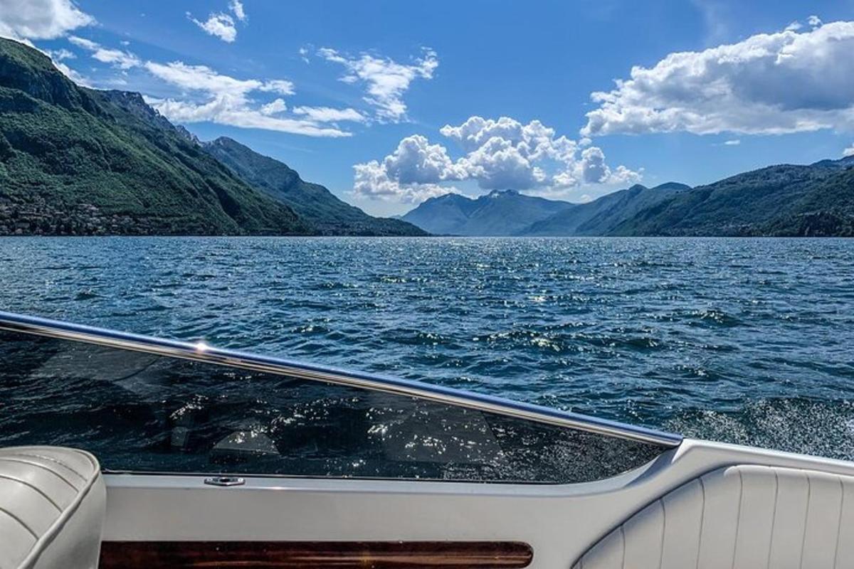 a boat on a large body of water with mountains