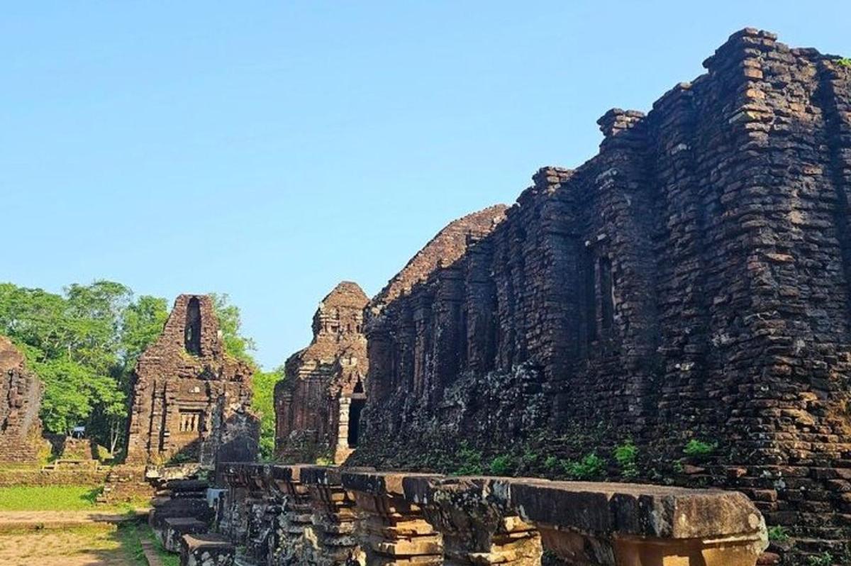 a large stone building with trees in the background
