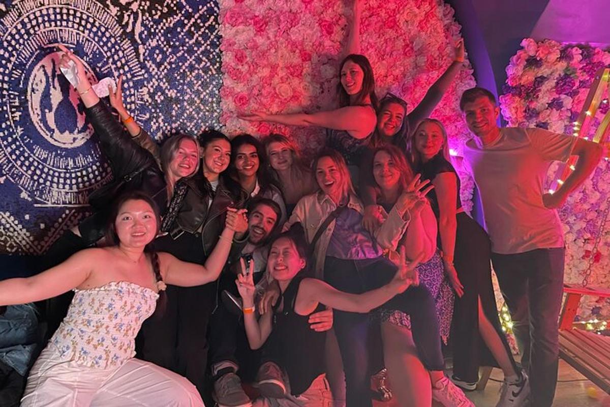 a group of people posing for a picture in a room