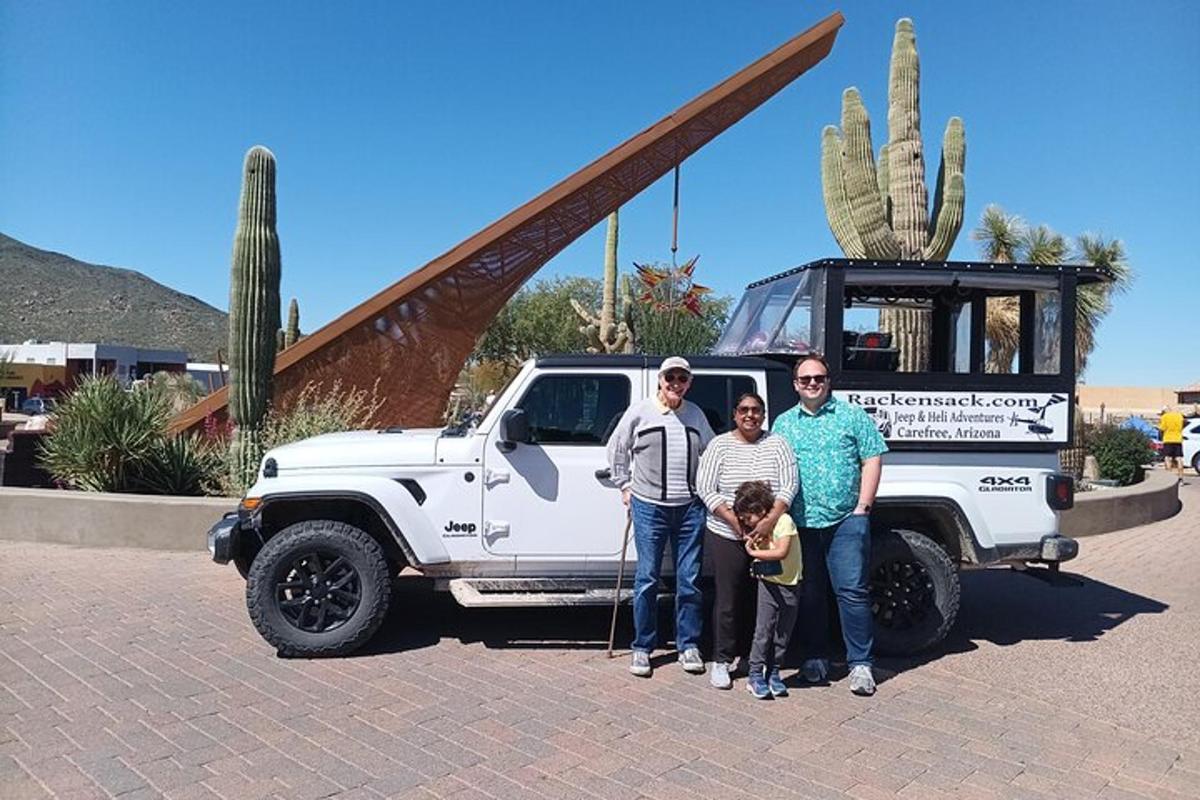 a group of people standing in front of a white truck