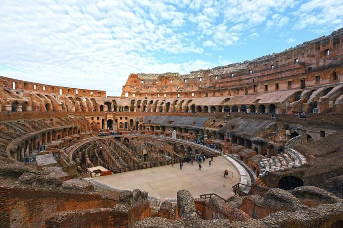 a large amphitheater with people walking inside of it