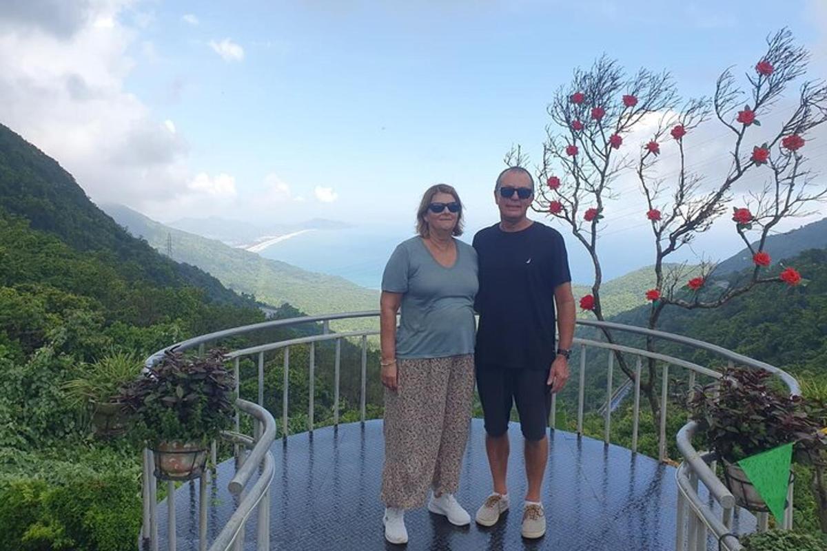 a man and a woman standing on a balcony