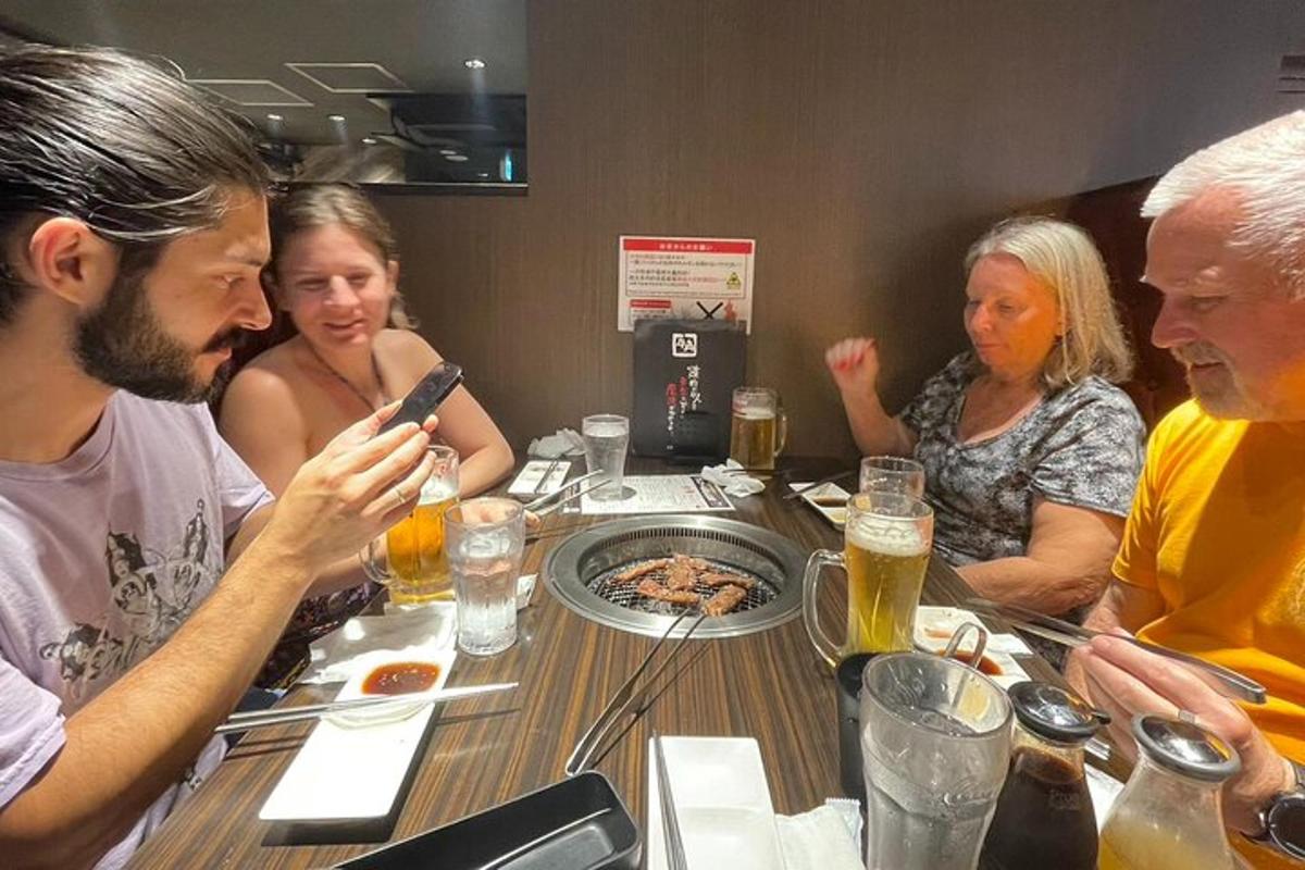 a group of people sitting around a table eating food