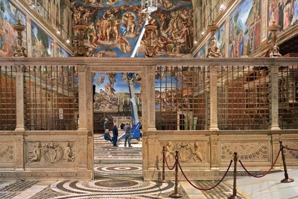 a large room with paintings on the walls of a building