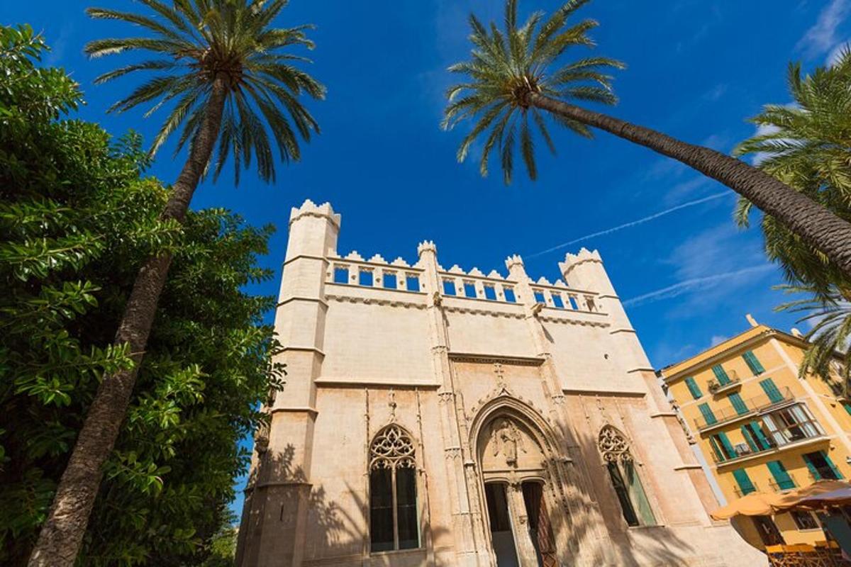 an old church with palm trees in front of it