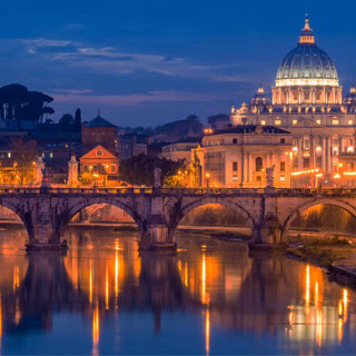 a bridge over a river with a building and a dome