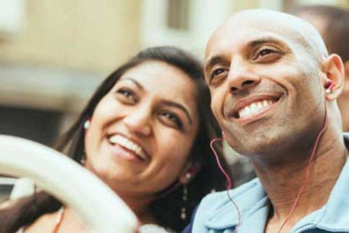 a man and a woman listening to music