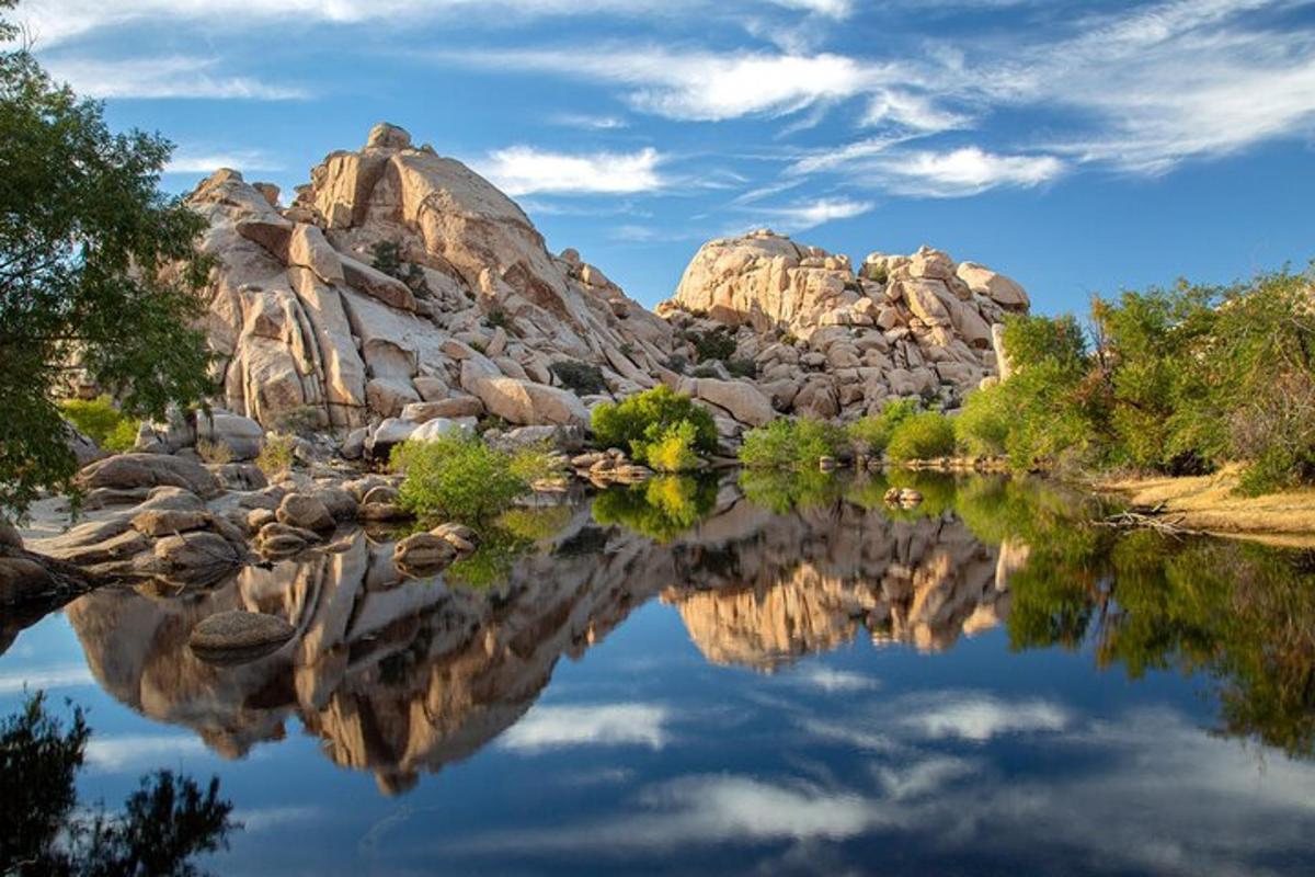 a reflection of a mountain in the water