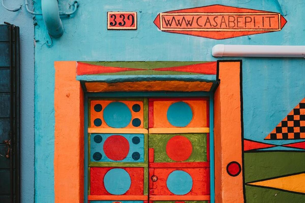 a painting of a toy house on the side of a building