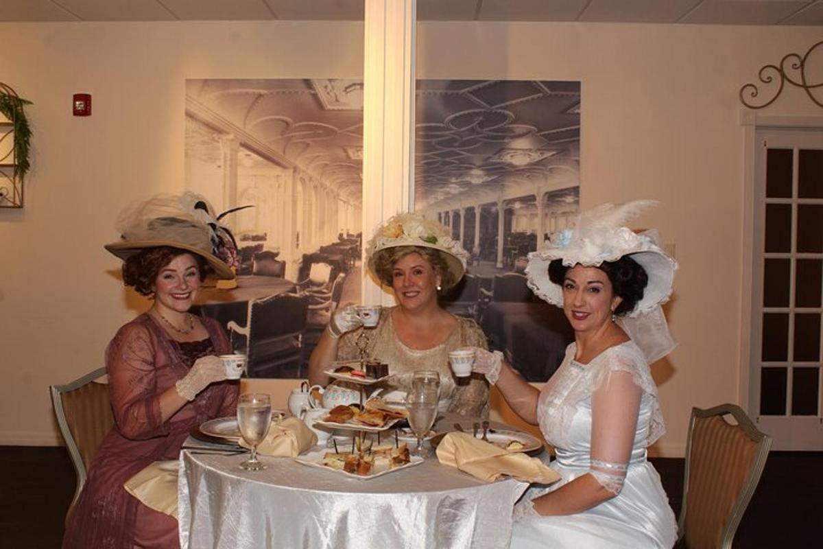 three women in hats sitting at a table