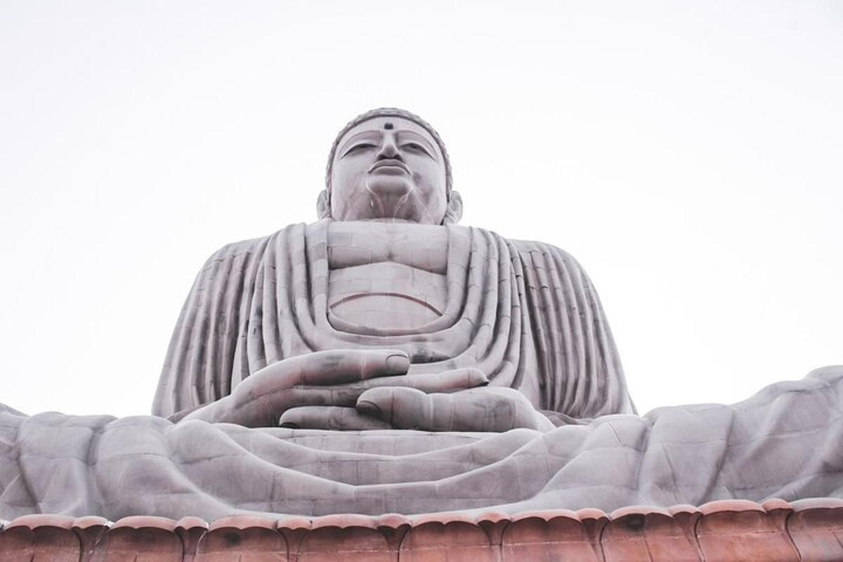 a large statue sitting on top of a building