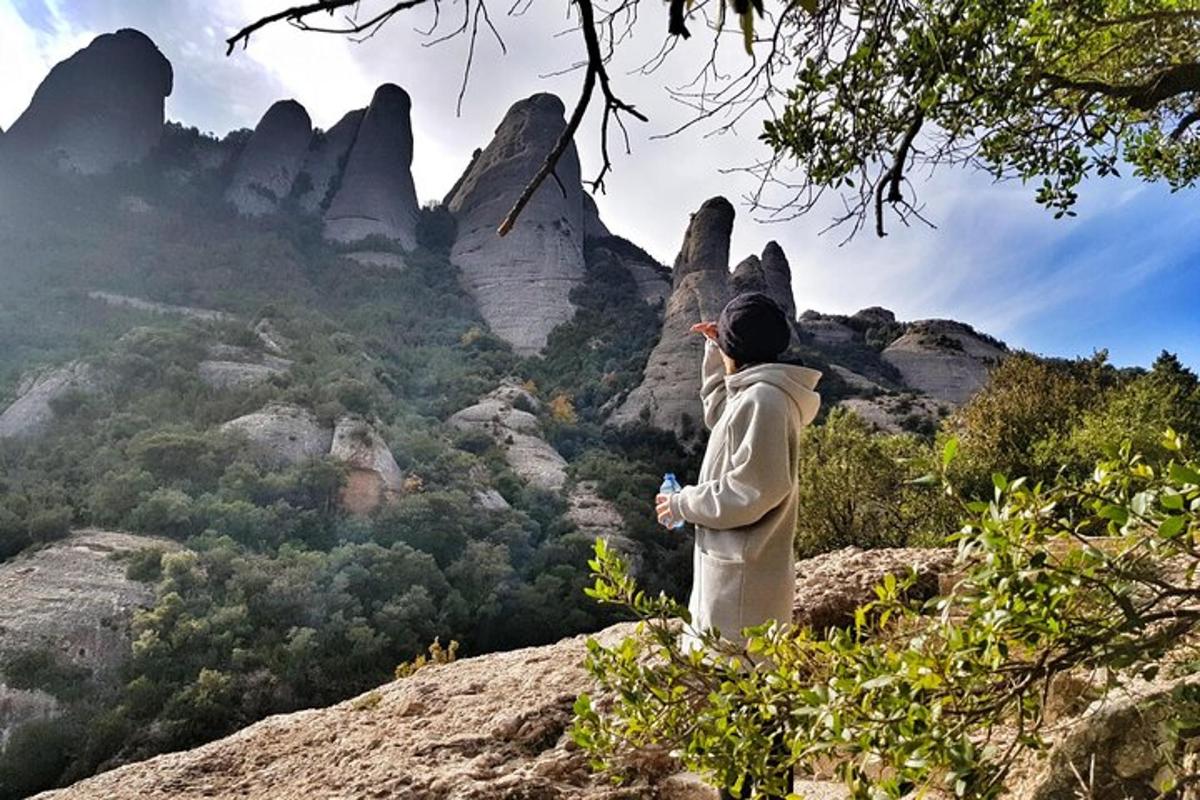 a person standing on top of a mountain looking at the view