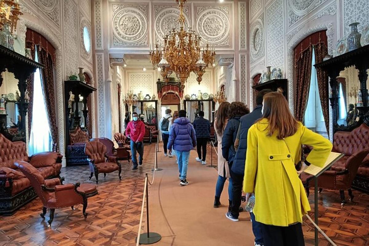 a group of people walking down a hallway in a building
