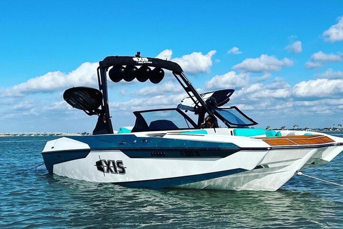 a blue and white boat sitting in the water