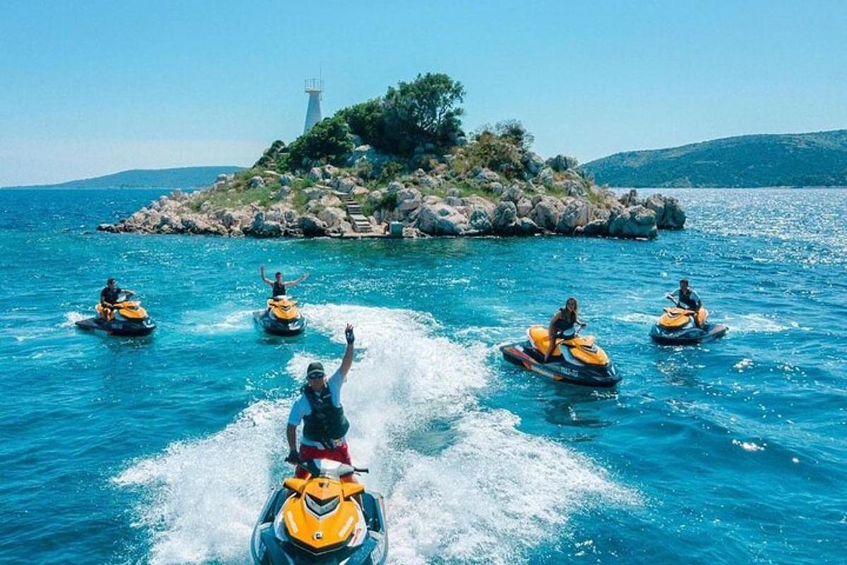 a group of people riding on kayaks in the water