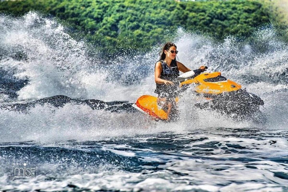 a woman riding a jet ski in the water